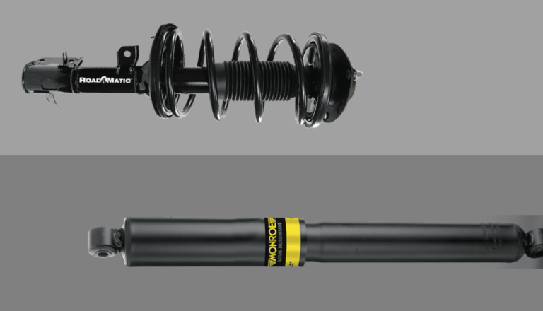 What is the difference between a strut and a shock absorber?